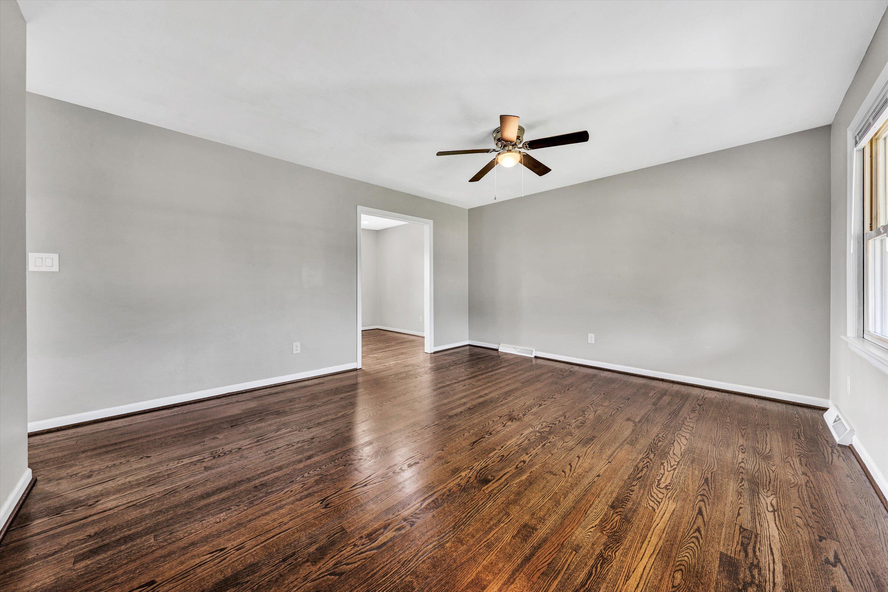 5225 Florist Road Roanoke, VA 24012 - Photo 5 of 38 a view of empty room with wooden floor and ceiling fan