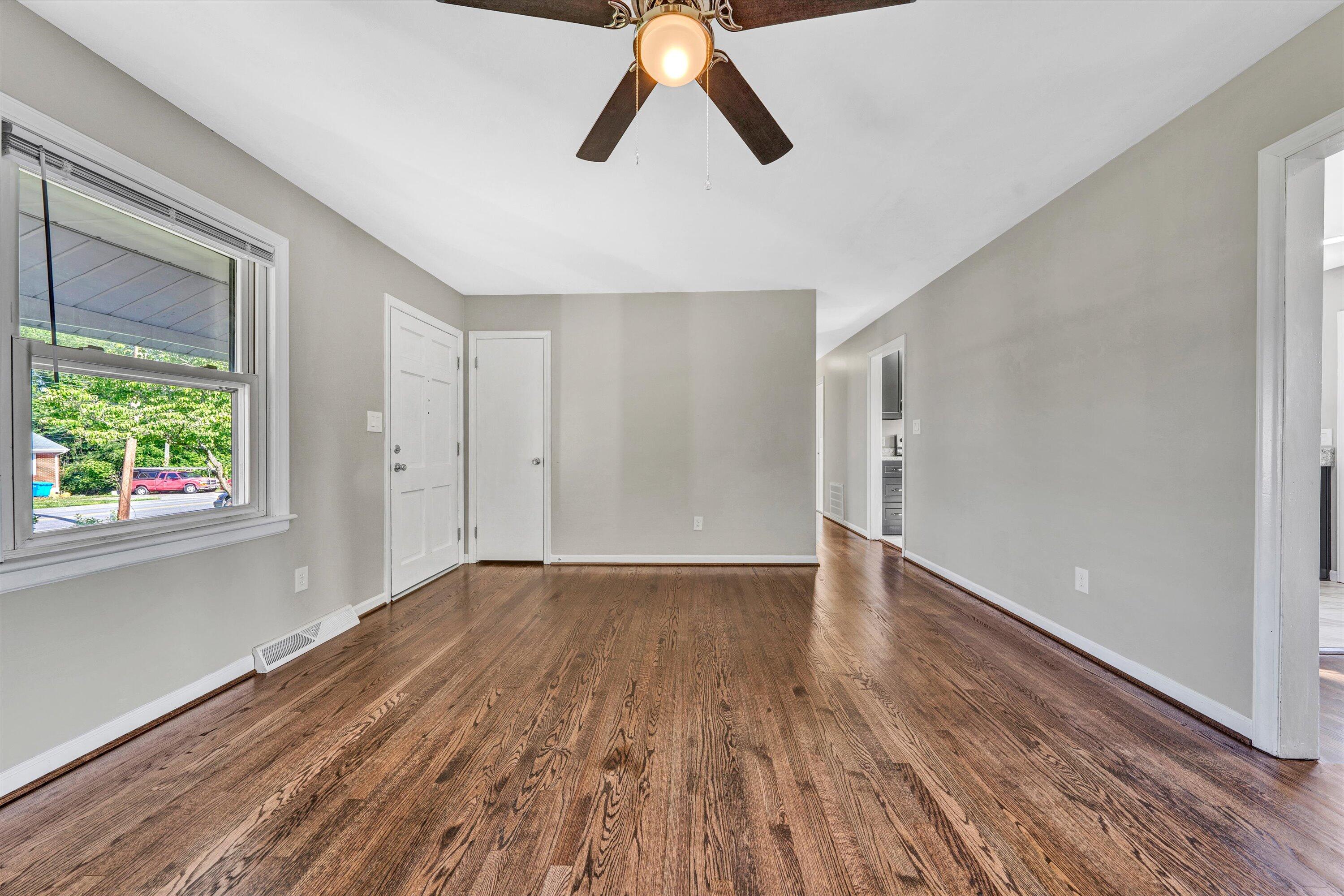 5225 Florist Road Roanoke, VA 24012 - Photo 6 of 38 a view of empty room with wooden floor and window