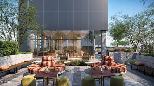 a view of a chair and tables in the balcony