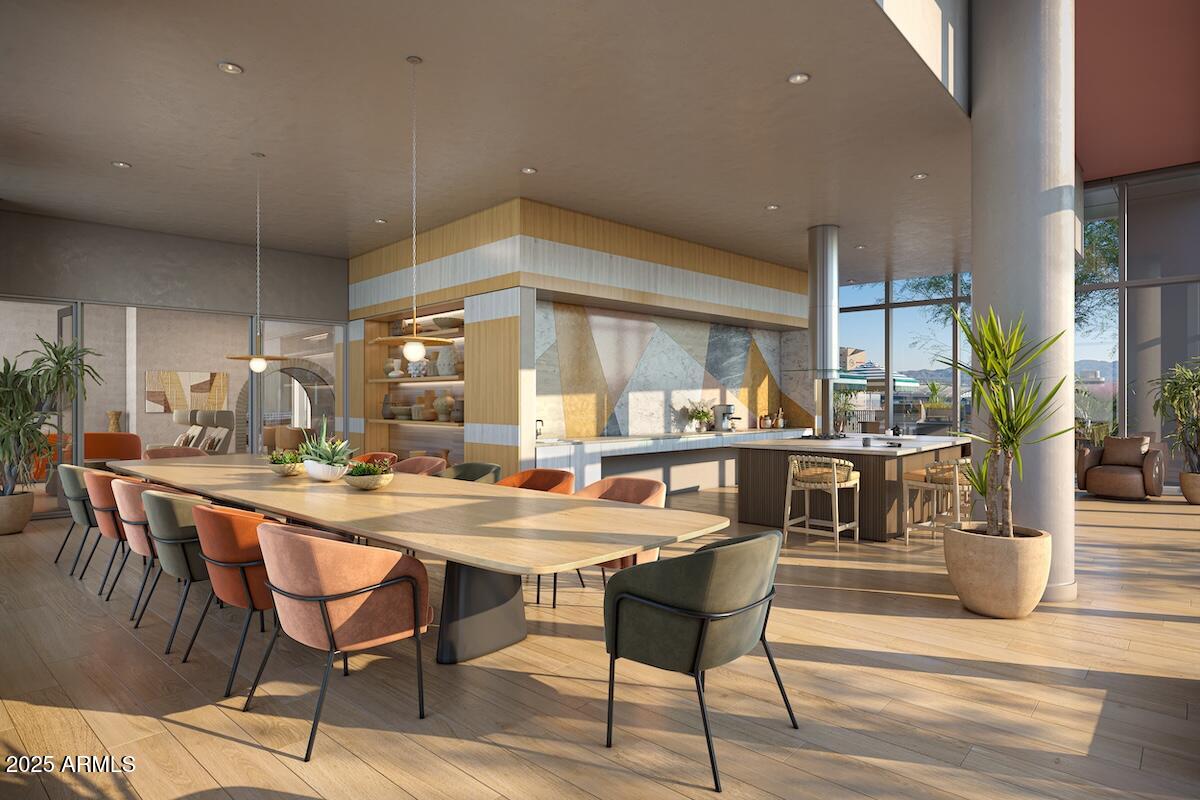 50 East Fillmore Street Phoenix, AZ 85004 - Photo 15 of 33 a dining hall with stainless steel appliances a dining table and chairs with wooden floor