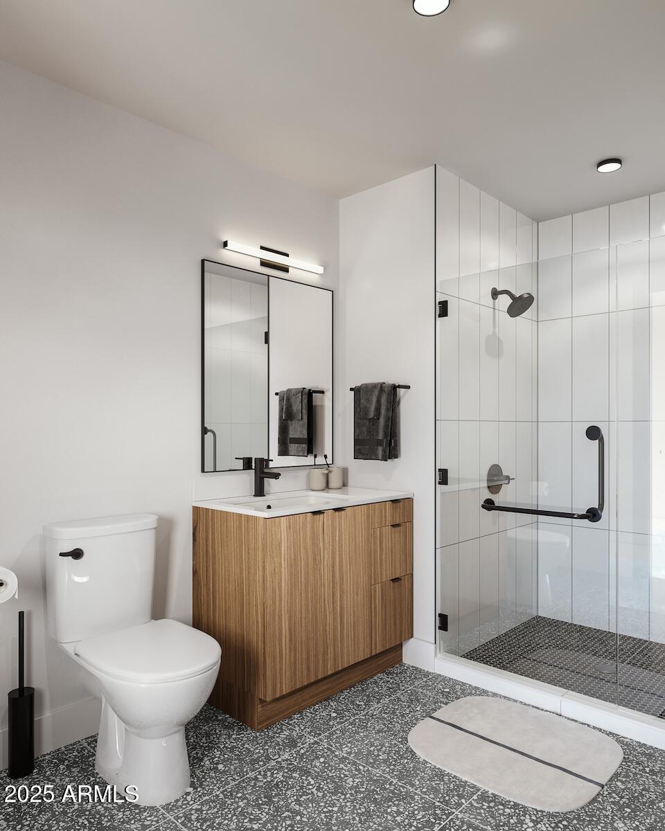 50 East Fillmore Street Phoenix, AZ 85004 - Photo 20 of 33 a bathroom with a toilet sink and shower