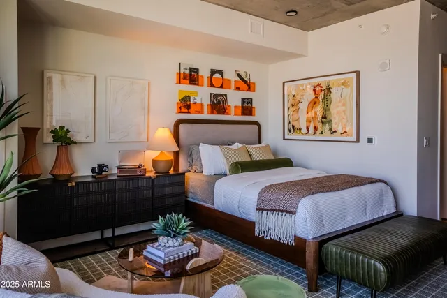 a bedroom with a bed and dresser