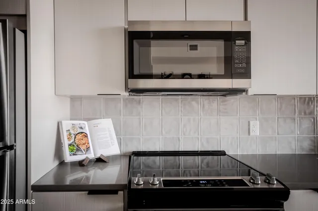 a kitchen with a stove and a refrigerator