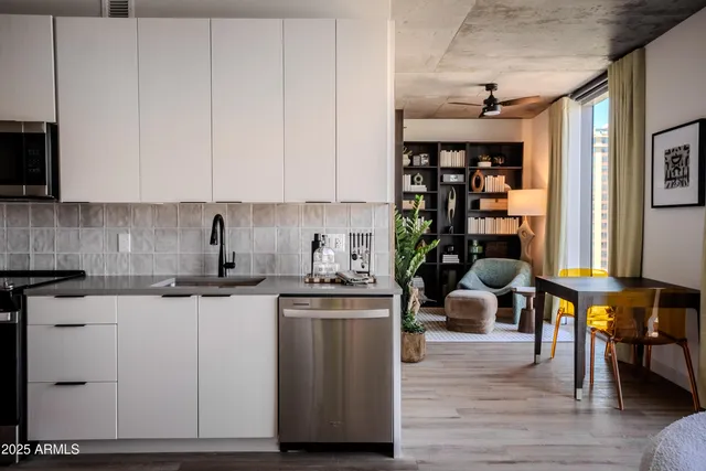 a bedroom with furniture and a rug