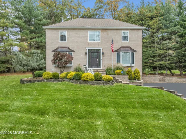 a front view of house with yard and green space
