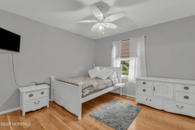a living room with furniture and flat screen tv