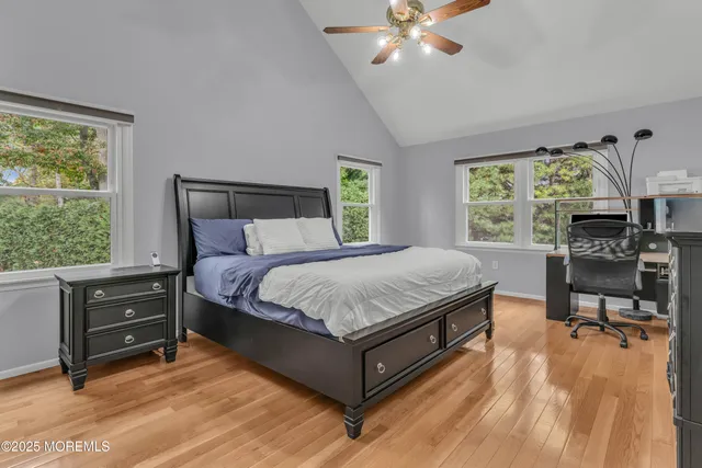 a bed room with a bed window and a chair