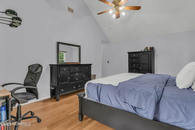 a bedroom with a bed and a dresser