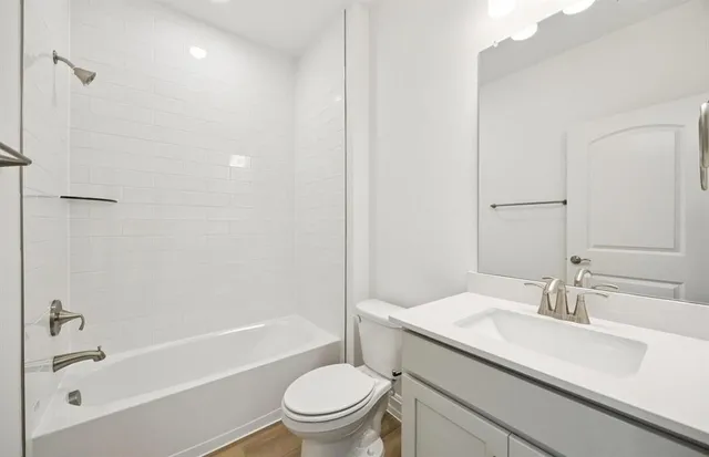 a bathroom with a sink a toilet and a bathtub