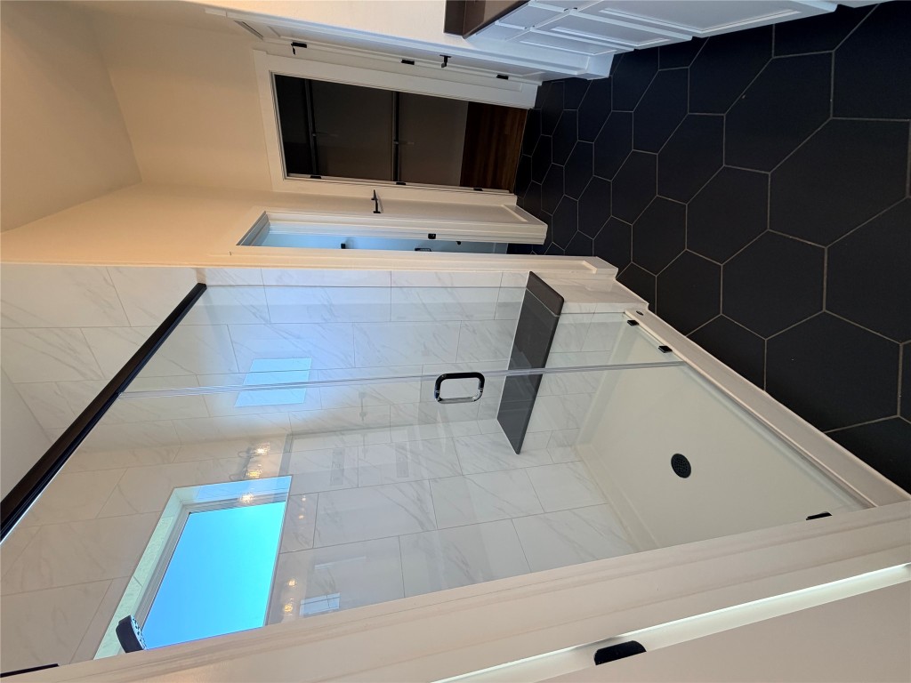 8604 Torrita Drive Round Rock, TX 78665 - Photo 11 of 26 a bathroom with a tub and a shower