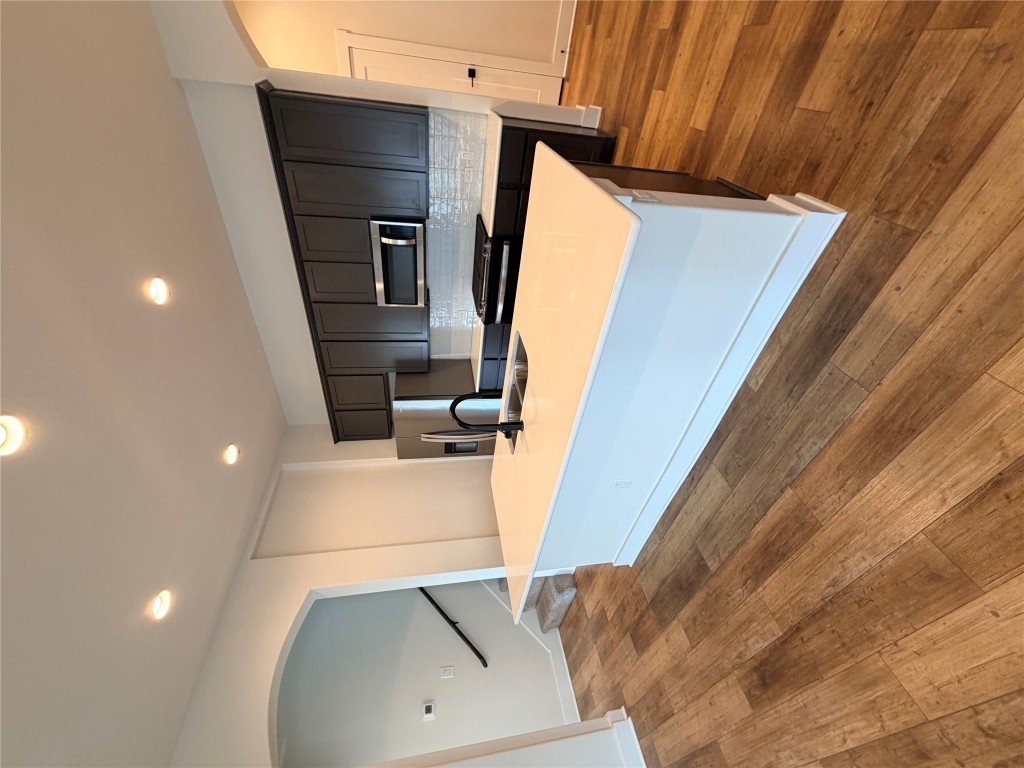 8604 Torrita Drive Round Rock, TX 78665 - Photo 5 of 26 a large kitchen with stainless steel appliances a large counter top