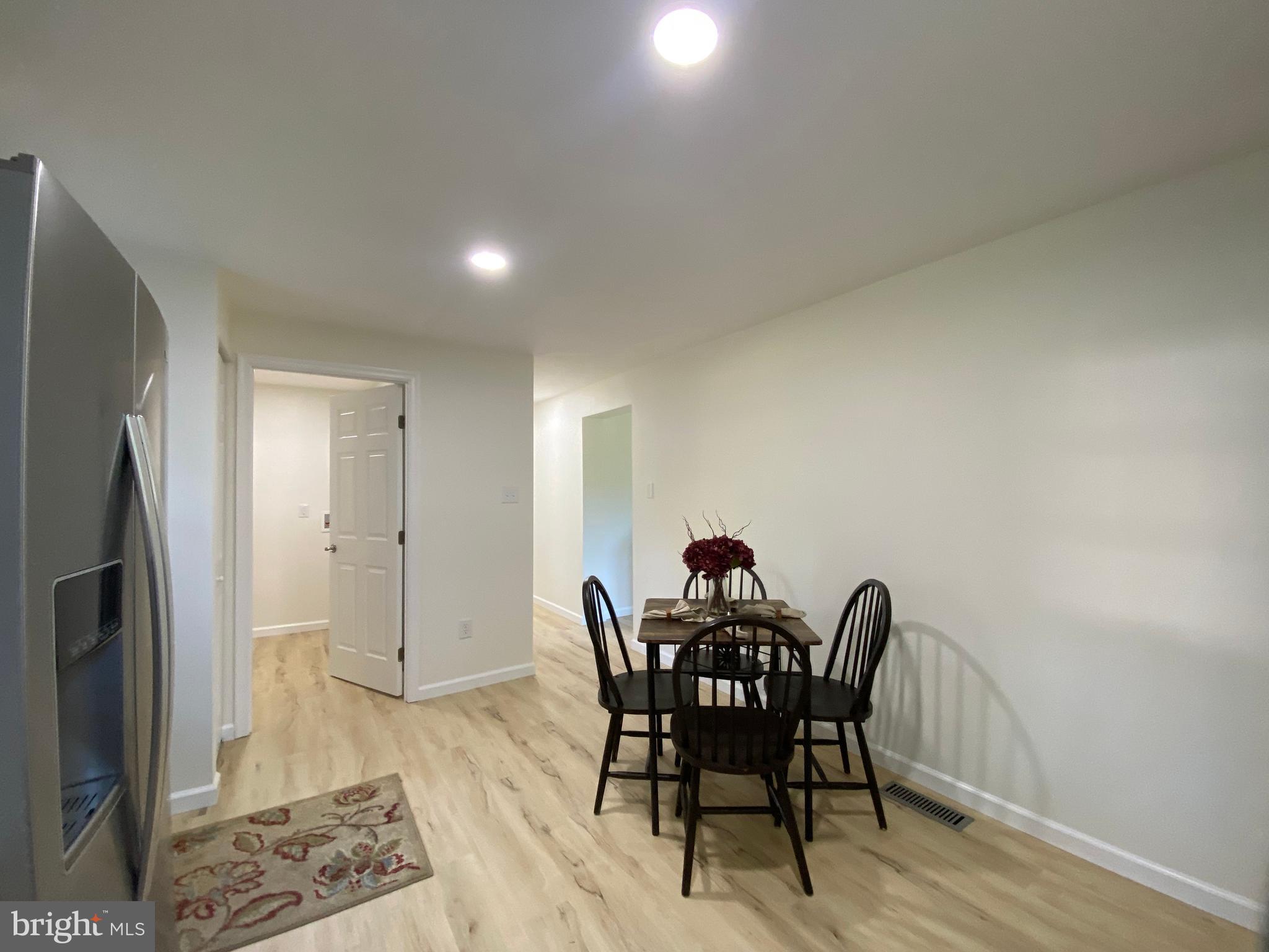 6797 Zion Church Road Salisbury, MD 21804 - Photo 11 of 39 a view of a dining room with furniture and wooden floor