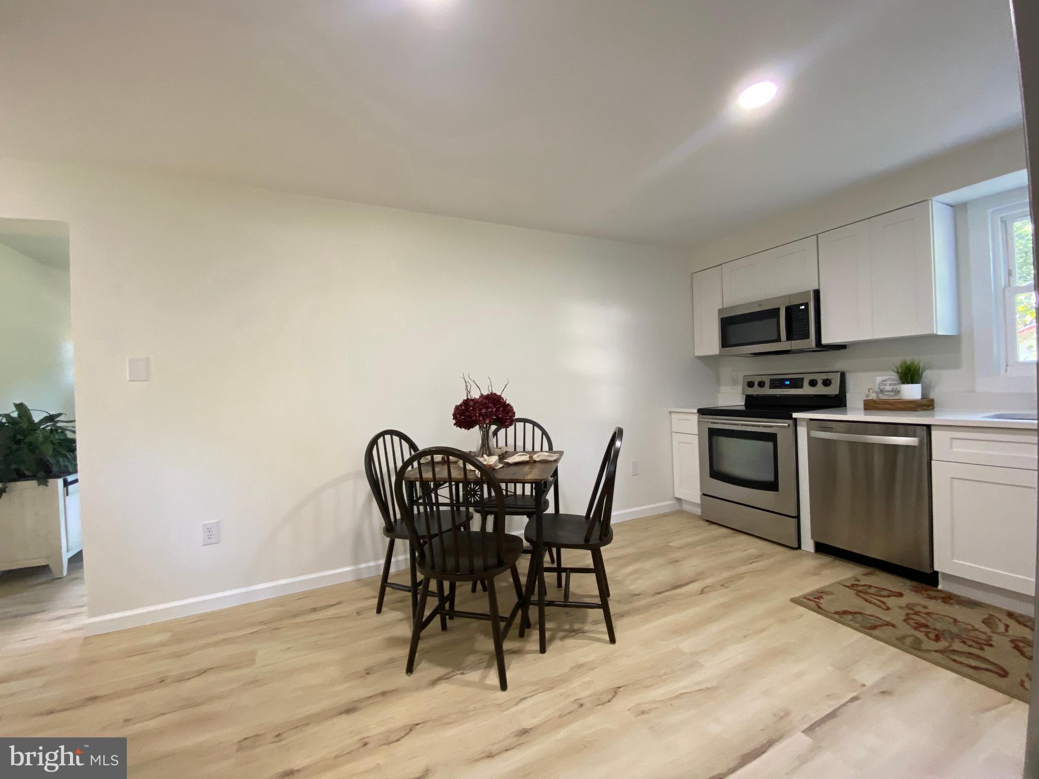 6797 Zion Church Road Salisbury, MD 21804 - Photo 12 of 39 a view of a dining room with furniture and wooden floor