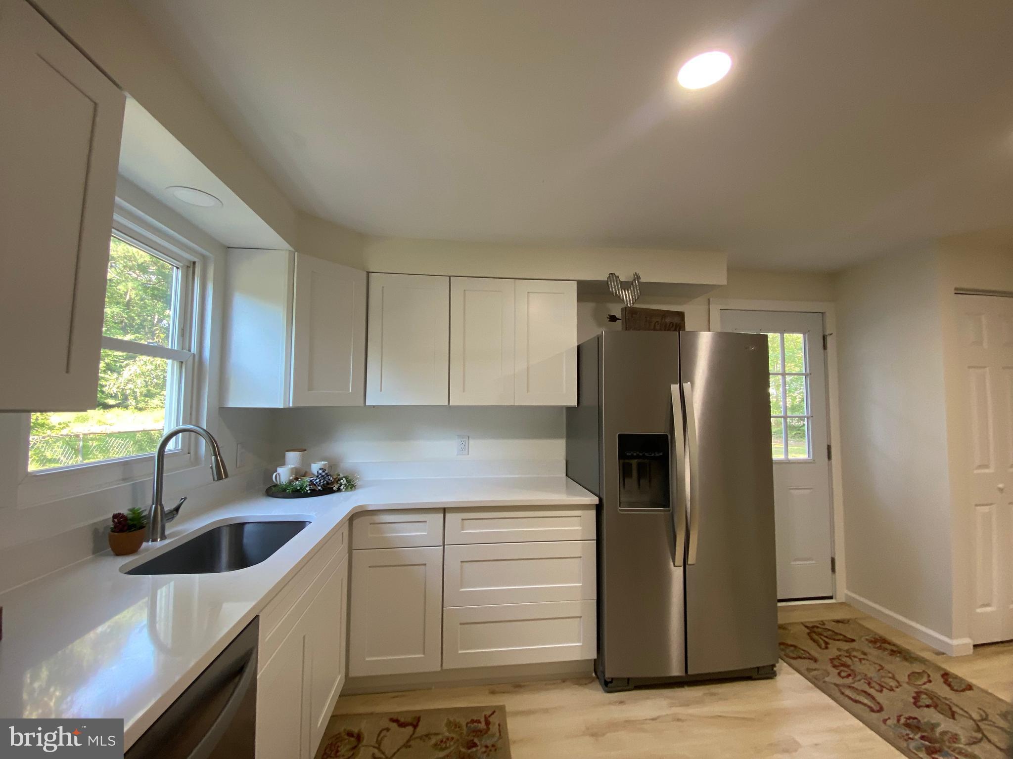 6797 Zion Church Road Salisbury, MD 21804 - Photo 14 of 39 a kitchen that has a sink cabinets counter space and appliances