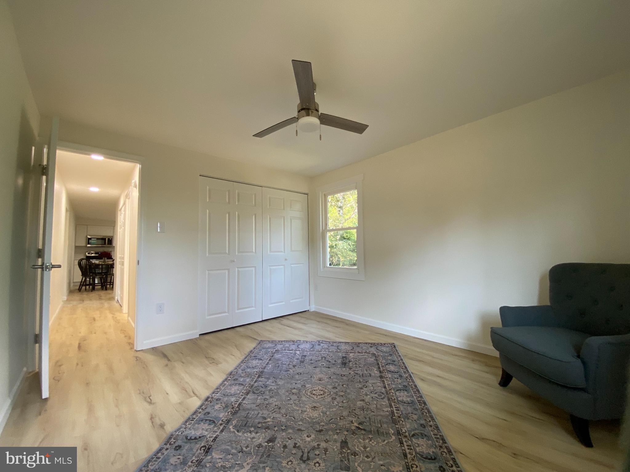 6797 Zion Church Road Salisbury, MD 21804 - Photo 22 of 39 a view of a livingroom with furniture and a ceiling fan