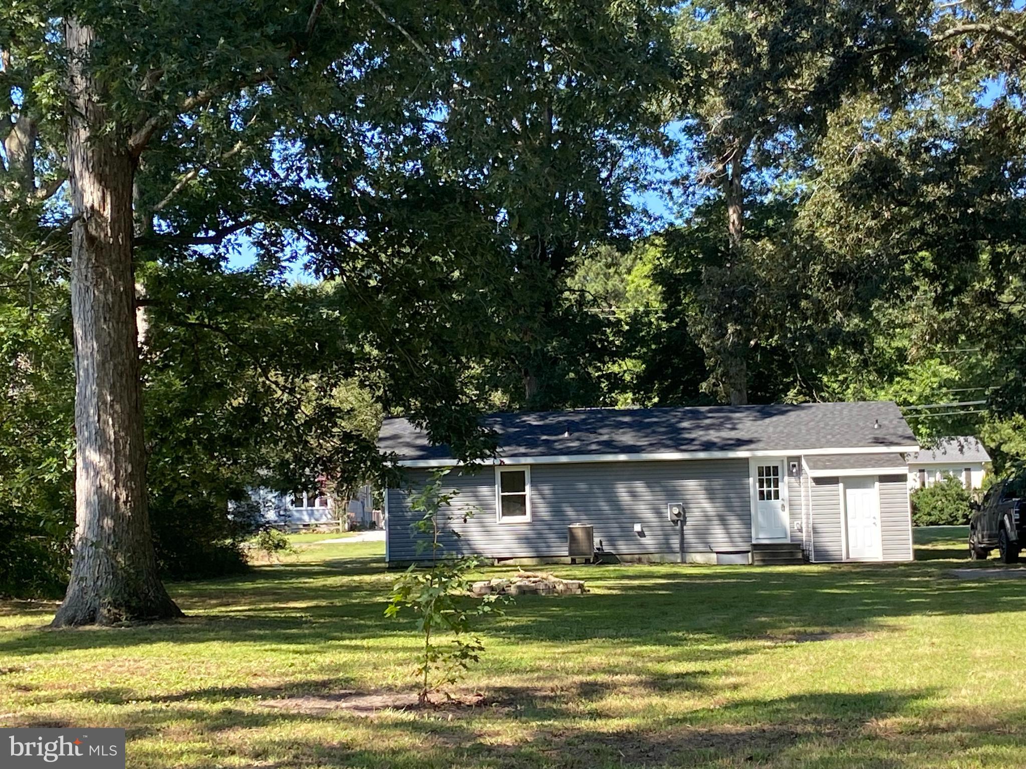 6797 Zion Church Road Salisbury, MD 21804 - Photo 37 of 39 a view of a house with a big yard potted plants and large tree