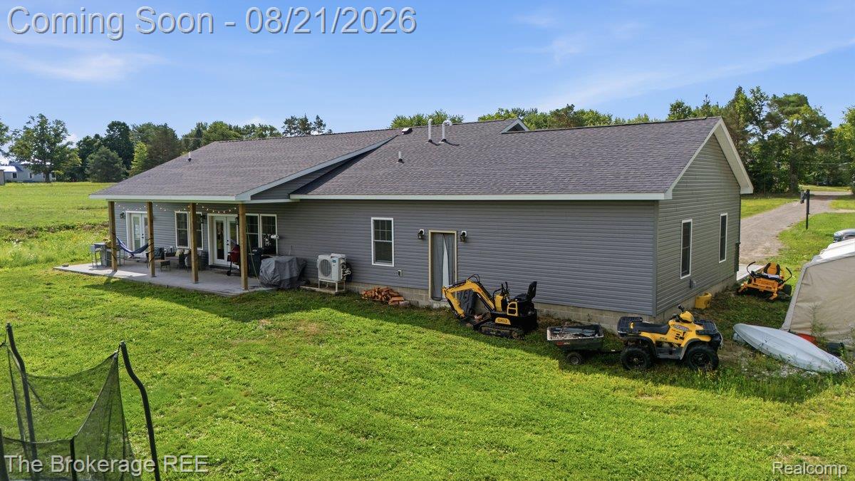 9161 East Coldwater Road Davison, MI 48423 - Photo 41 of 52 Gray siding exterior with a dark shingle roof