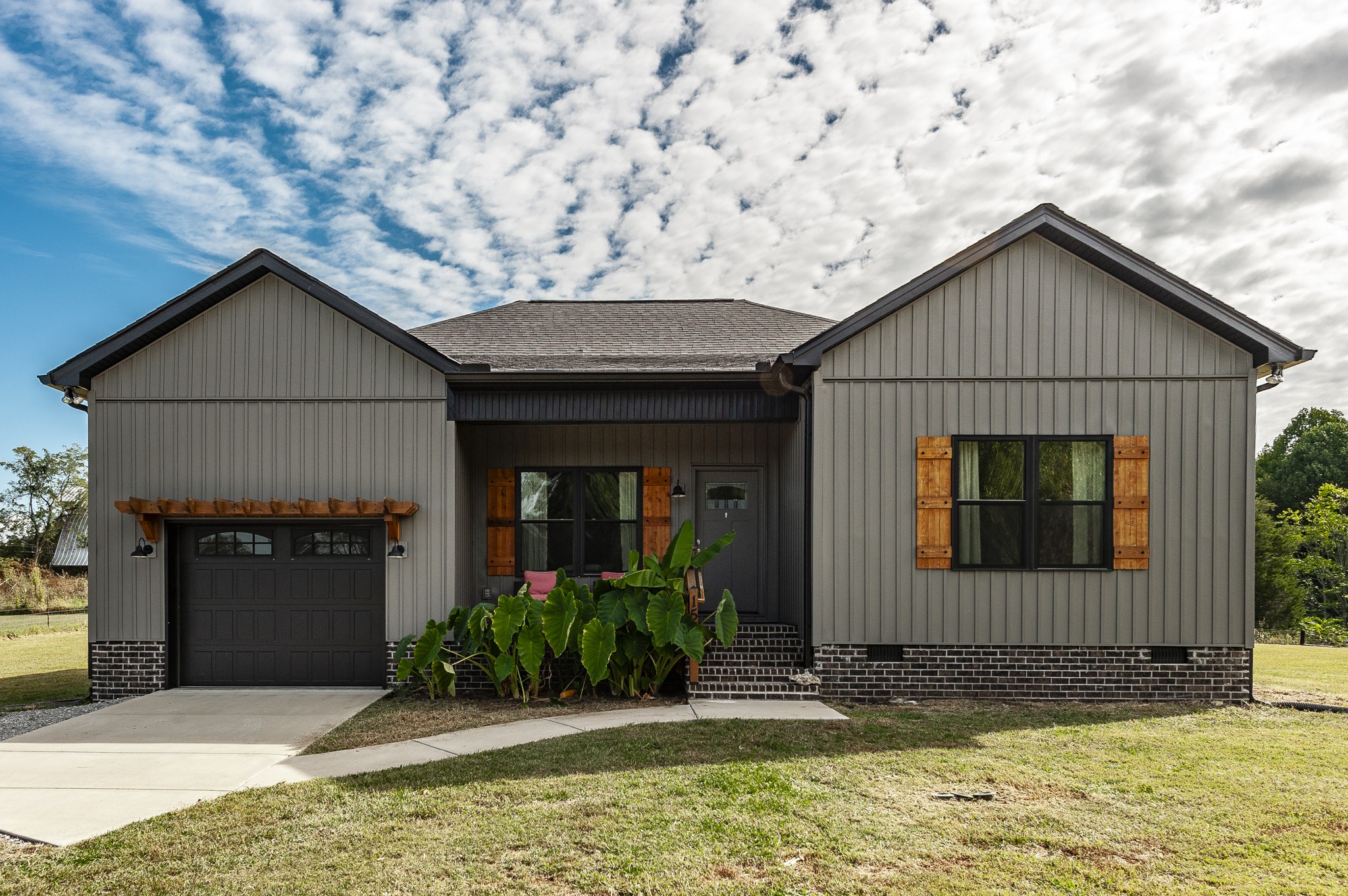 a front view of a house with garden