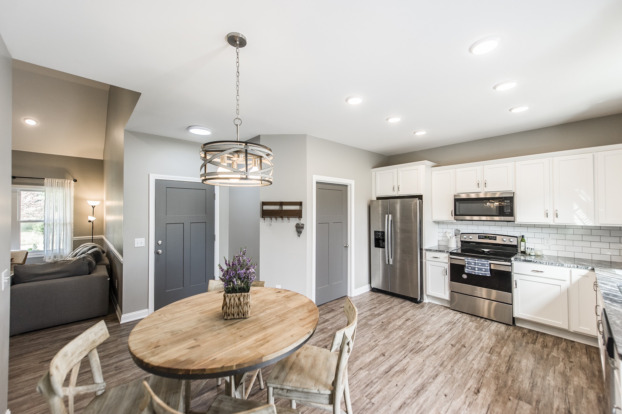 1502 Rock Bridge Road Bethpage, TN 37022 - Photo 12 of 37 a kitchen with refrigerator a sink and chairs