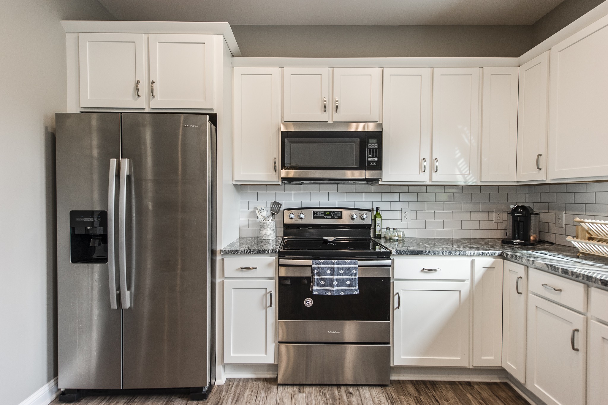1502 Rock Bridge Road Bethpage, TN 37022 - Photo 13 of 37 a kitchen with cabinets stainless steel appliances and a sink