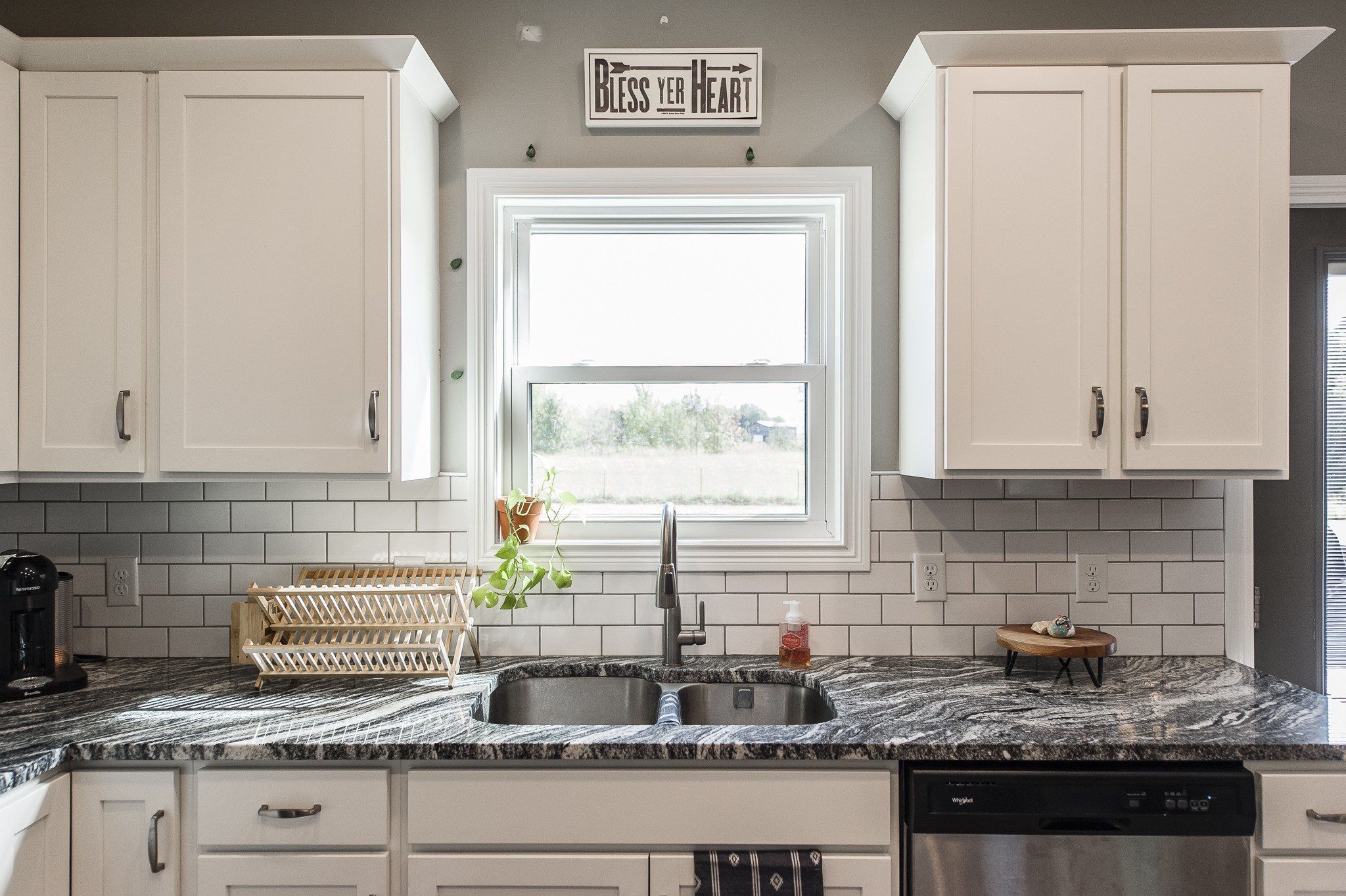 1502 Rock Bridge Road Bethpage, TN 37022 - Photo 17 of 37 a kitchen with granite countertop a sink a window and cabinets
