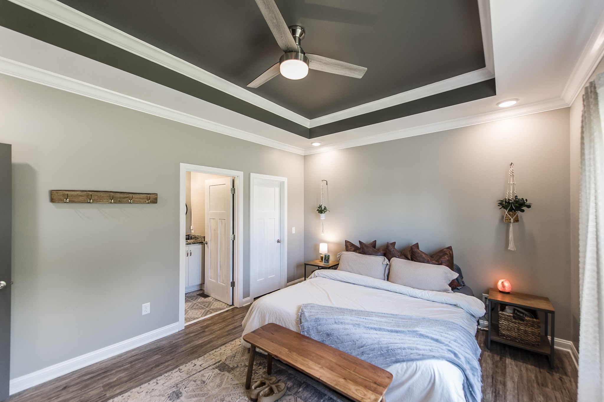 1502 Rock Bridge Road Bethpage, TN 37022 - Photo 19 of 37 a bedroom with a bed and a chandelier