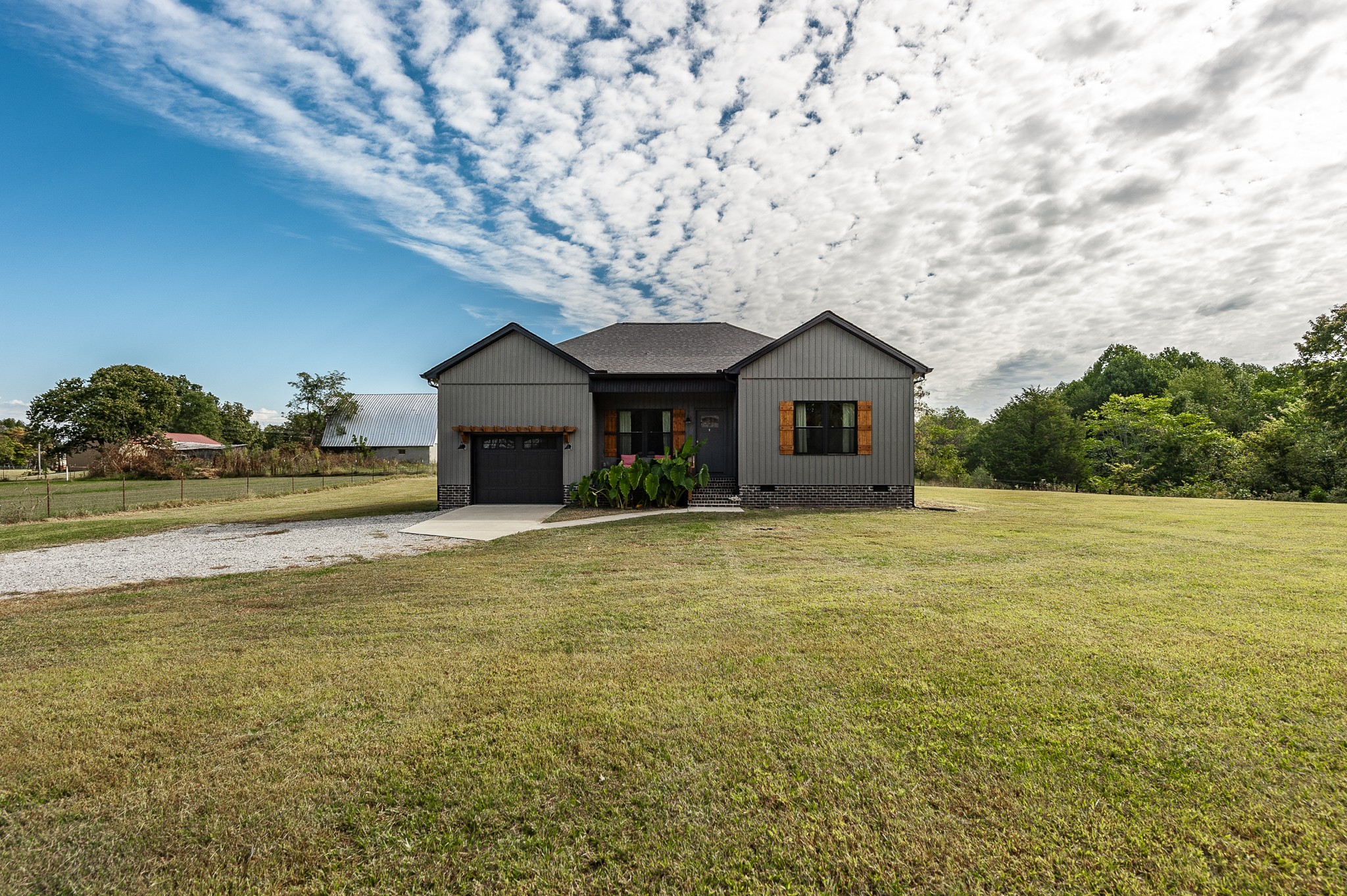 1502 Rock Bridge Road Bethpage, TN 37022 - Photo 2 of 37 a front view of a house with garden