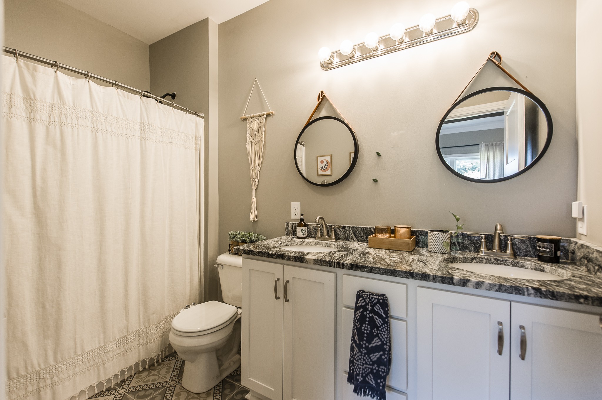 1502 Rock Bridge Road Bethpage, TN 37022 - Photo 22 of 37 a bathroom with a granite countertop toilet sink and mirror