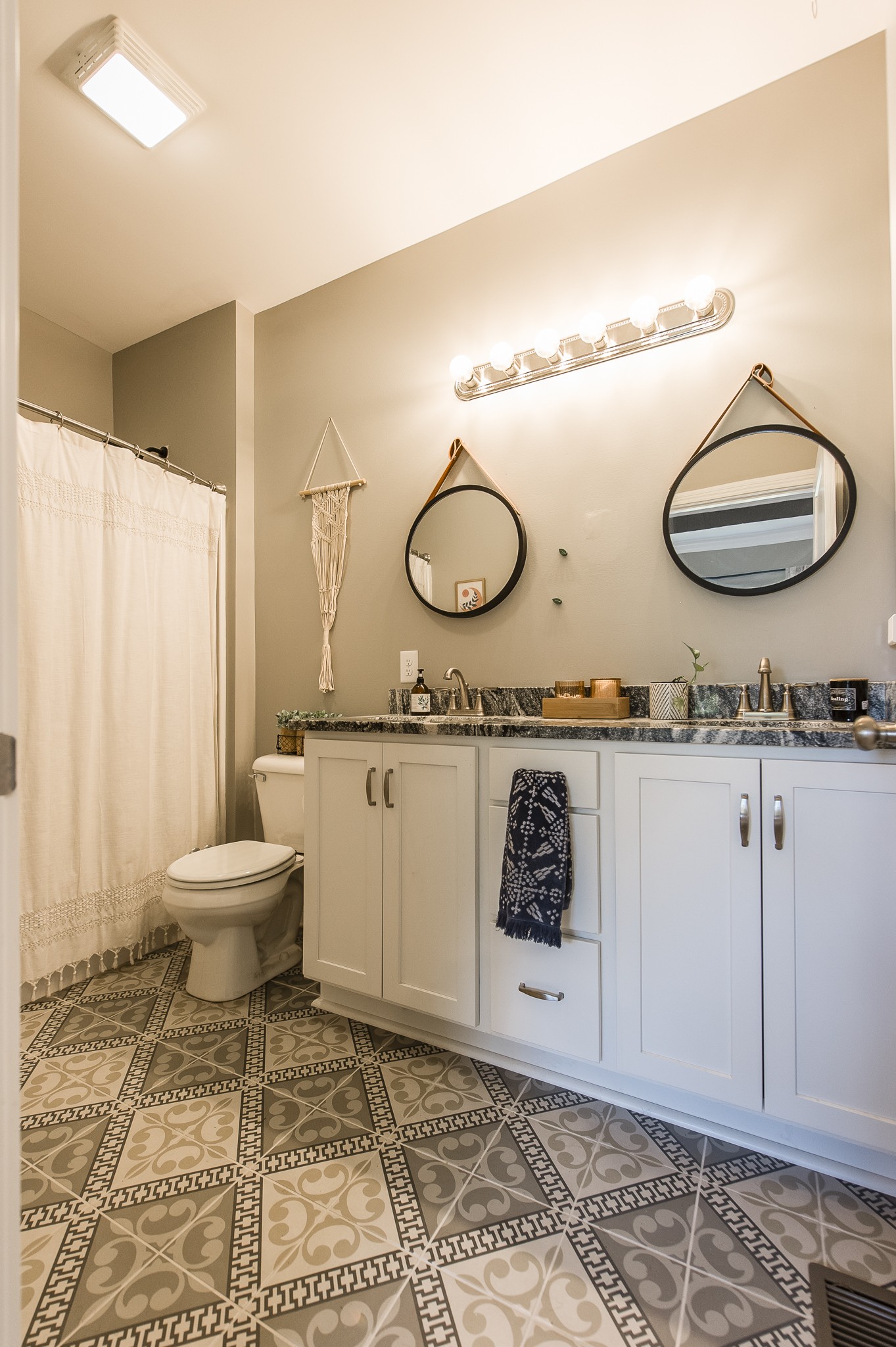 1502 Rock Bridge Road Bethpage, TN 37022 - Photo 23 of 37 a bathroom with a granite countertop toilet sink mirror and vanity