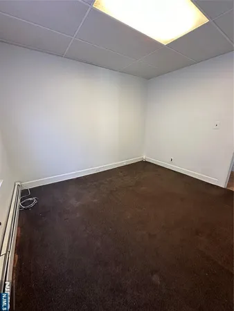 an empty room with a bench