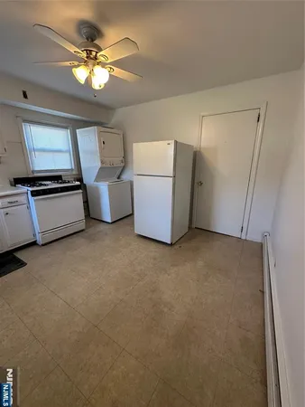 a room with furniture and a ceiling fan