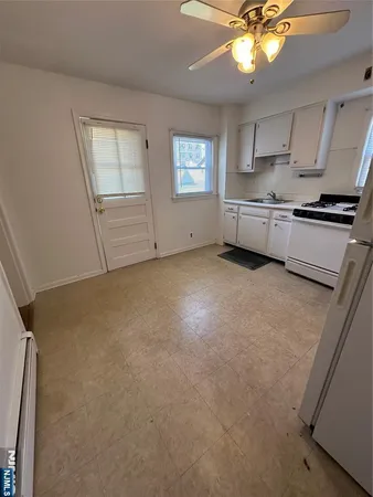 a view of a kitchen with a sink cabinets and window