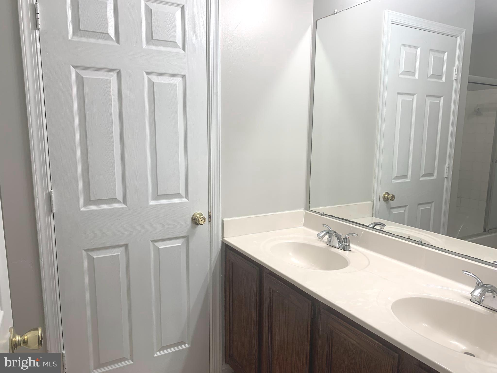 224 Gentlebrook Road Owings Mills, MD 21117 - Photo 13 of 24 a bathroom with a sink and a mirror