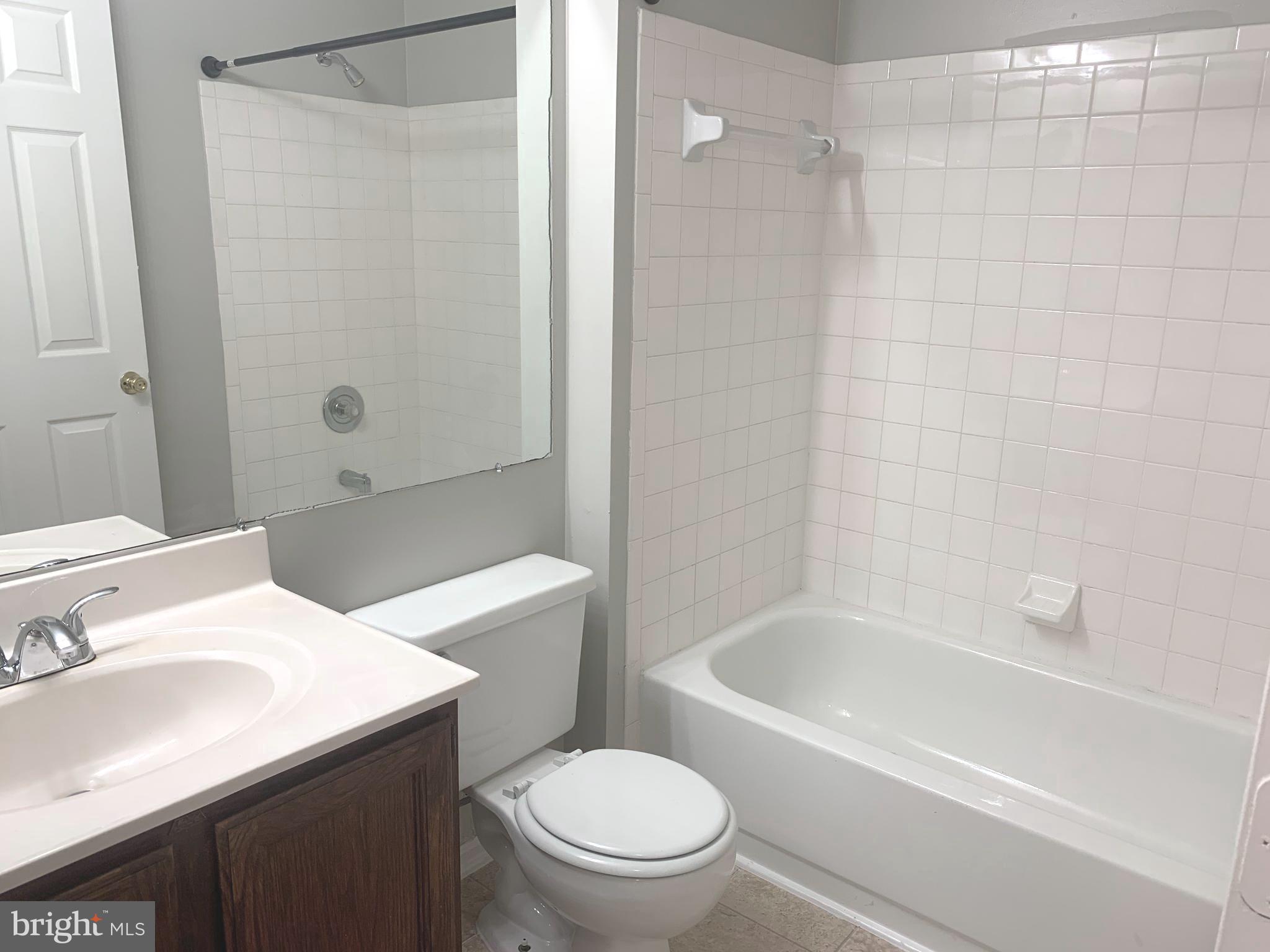 224 Gentlebrook Road Owings Mills, MD 21117 - Photo 20 of 24 a bathroom with a sink a toilet and a bathtub