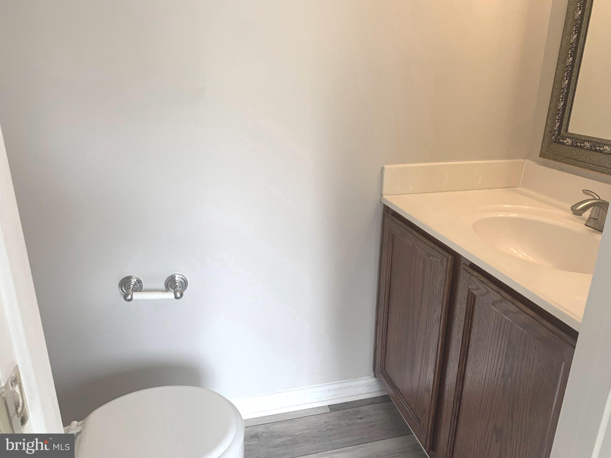 224 Gentlebrook Road Owings Mills, MD 21117 - Photo 10 of 24 a bathroom with a granite countertop sink toilet and shower