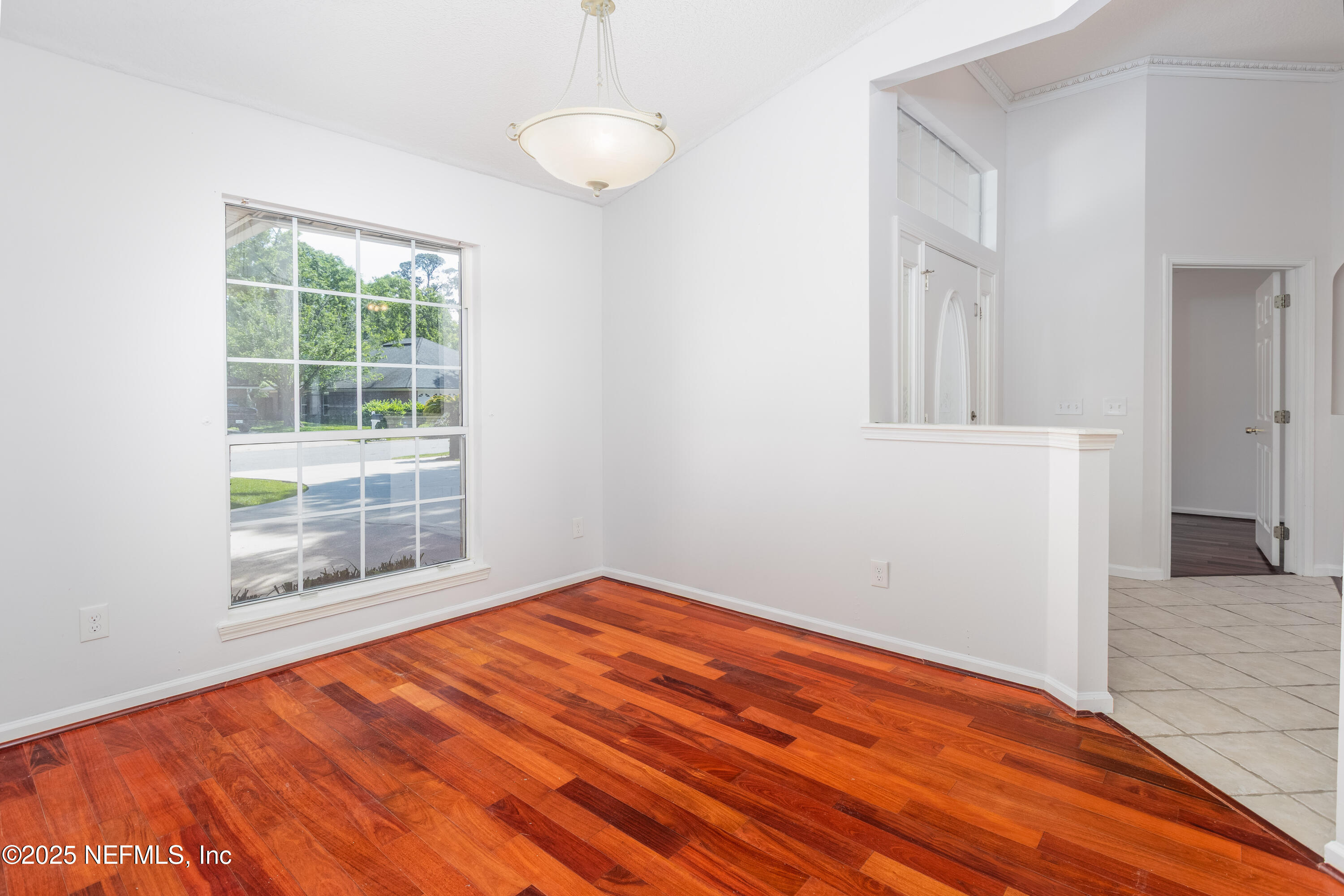 13775 Danforth Drive South Jacksonville, FL 32224 - Photo 11 of 38 a view of empty room with wooden floor and fan