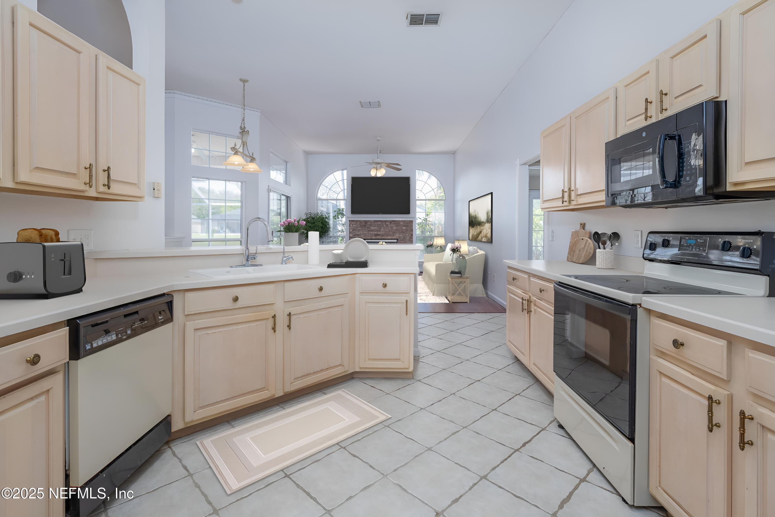13775 Danforth Drive South Jacksonville, FL 32224 - Photo 13 of 38 a kitchen with stainless steel appliances a sink stove and cabinets