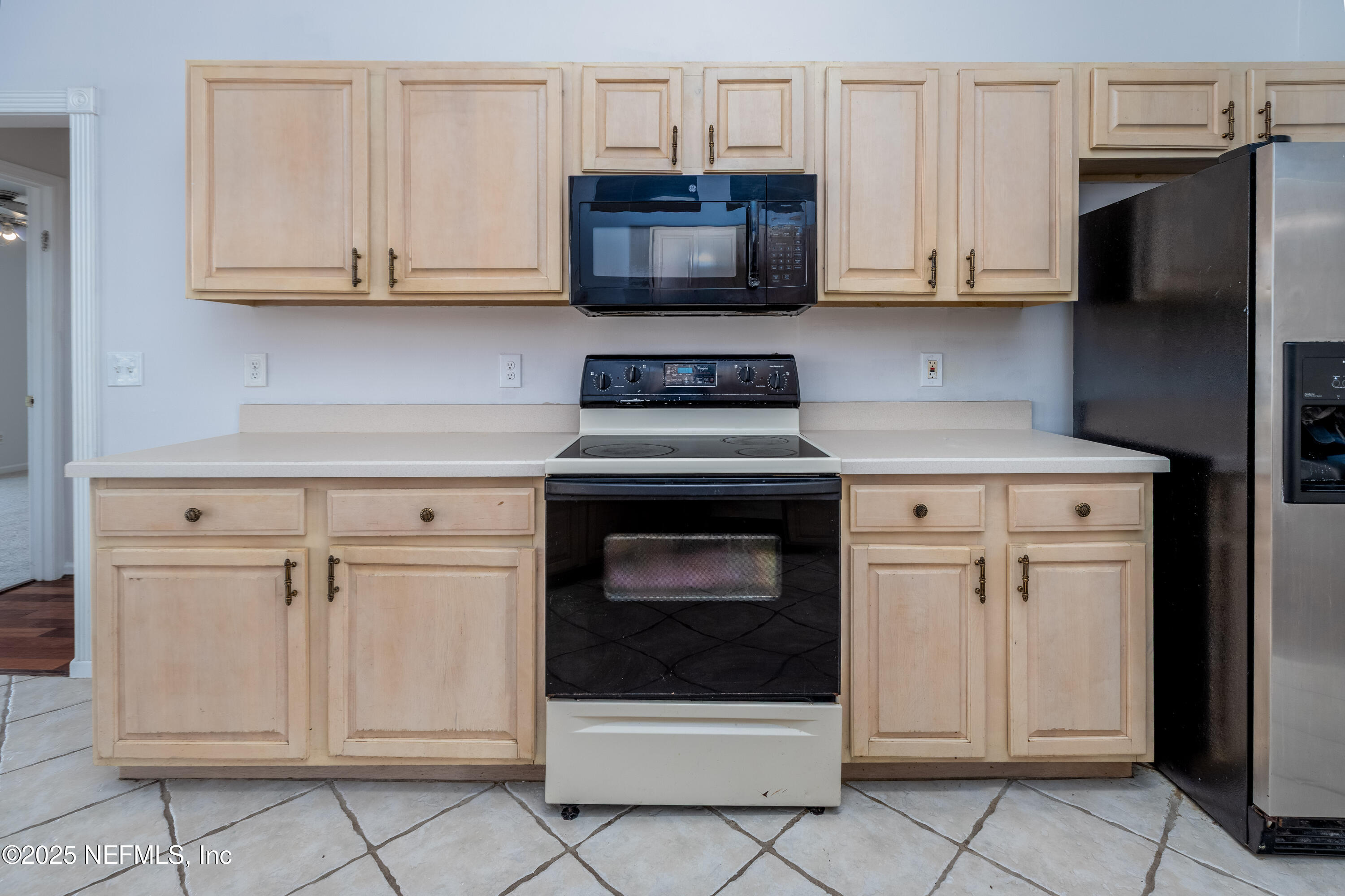 13775 Danforth Drive South Jacksonville, FL 32224 - Photo 15 of 38 a kitchen with granite countertop white cabinets and stainless steel appliances