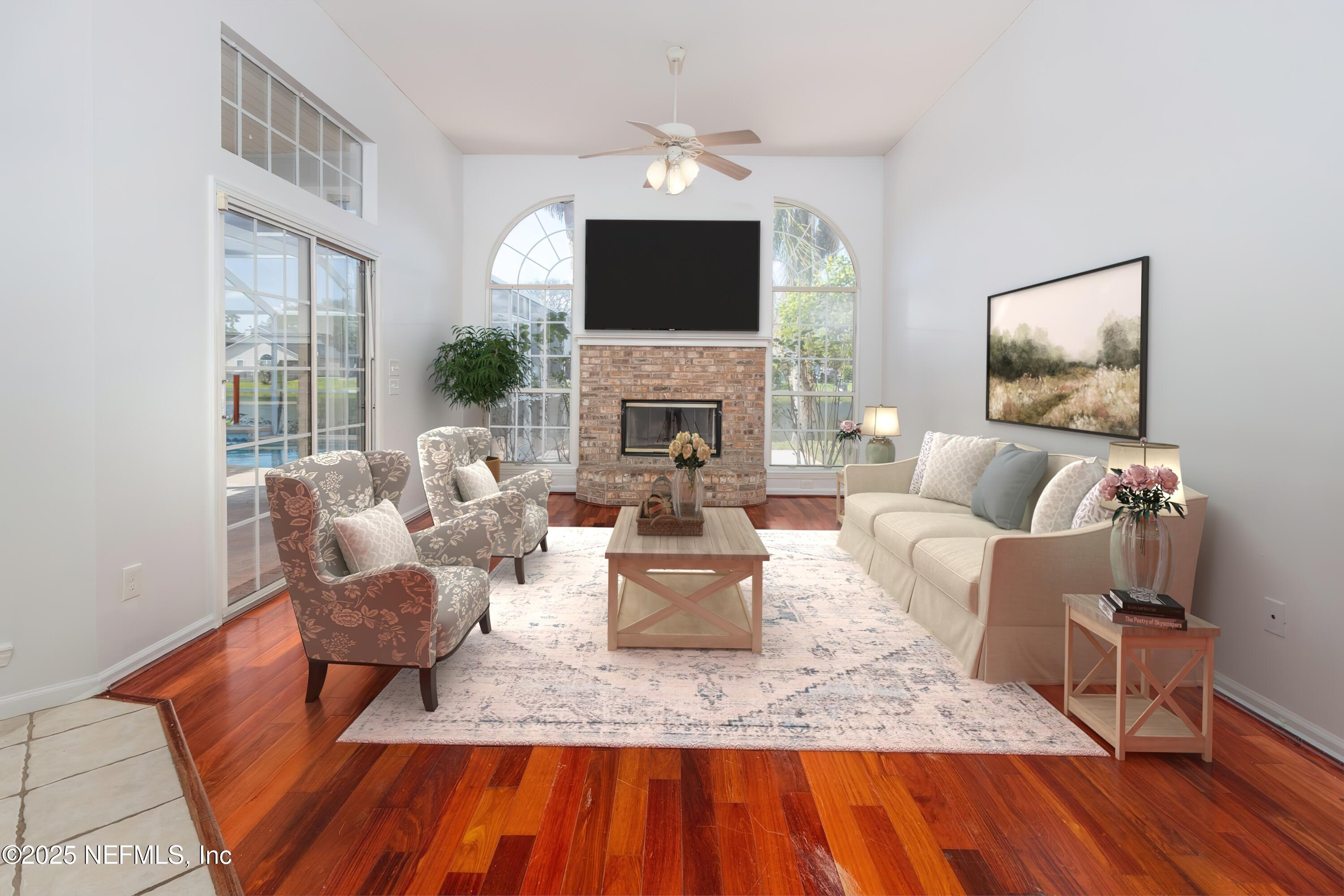 13775 Danforth Drive South Jacksonville, FL 32224 - Photo 17 of 38 a living room with furniture a fireplace and a flat screen tv
