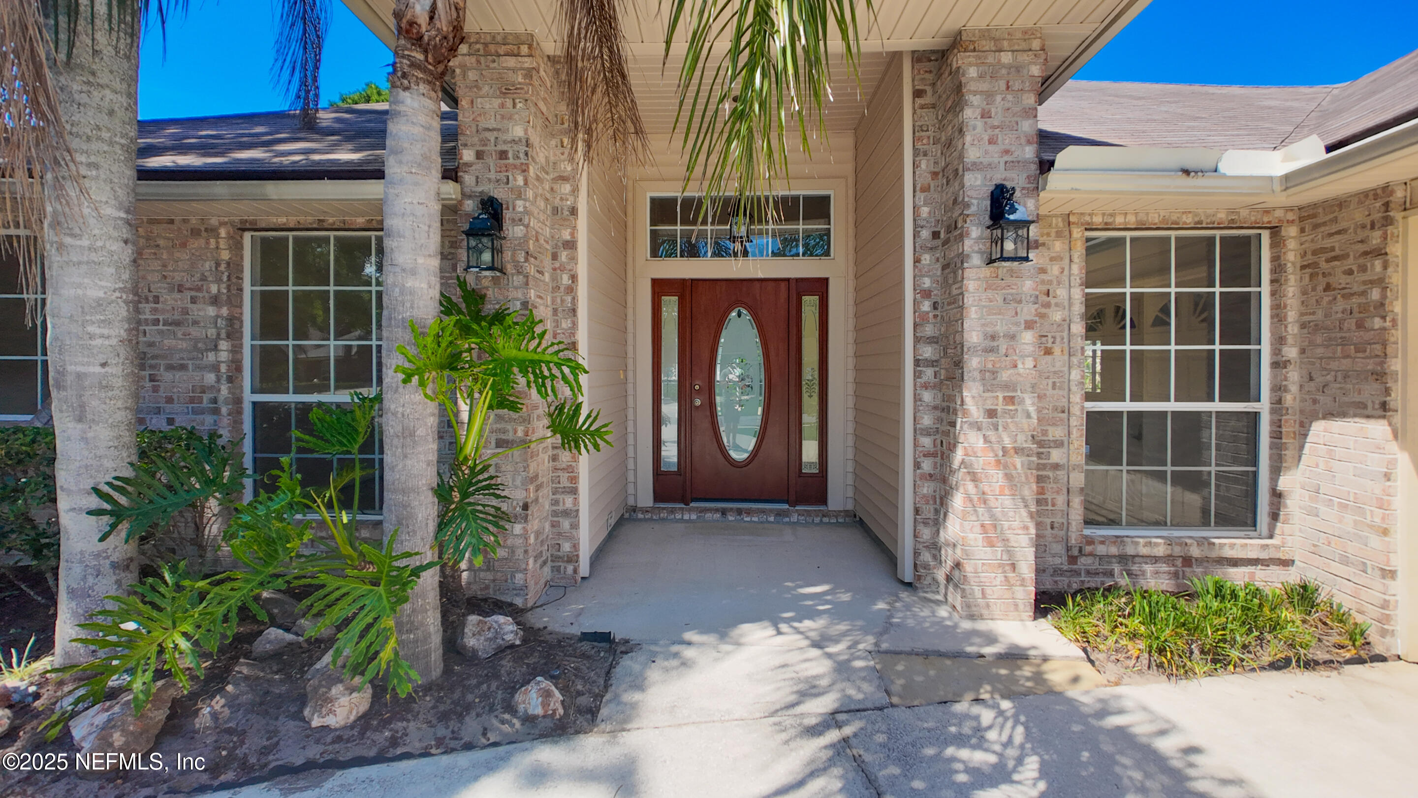 13775 Danforth Drive South Jacksonville, FL 32224 - Photo 3 of 38 a front view of a house with a garden
