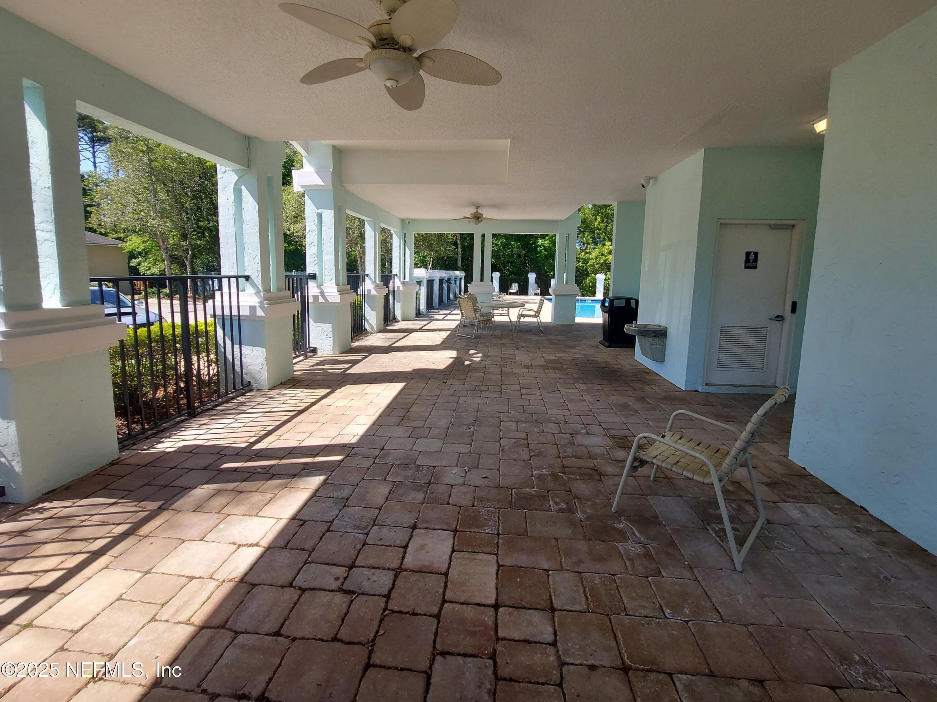 13775 Danforth Drive South Jacksonville, FL 32224 - Photo 37 of 38 a view of a patio with table and chairs with wooden floor and fence