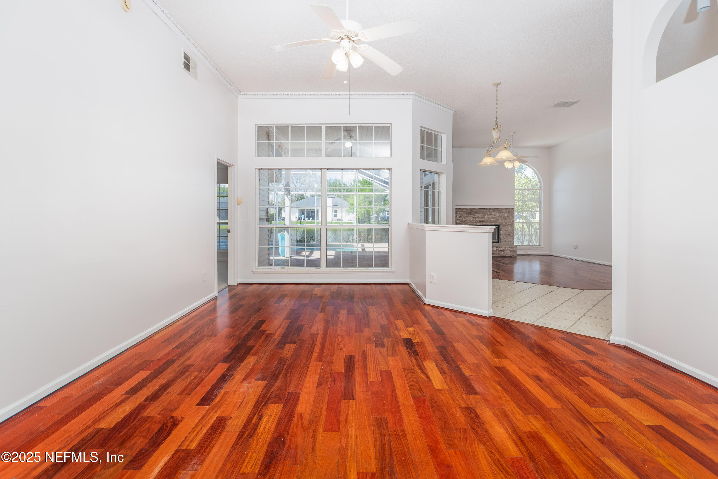 13775 Danforth Drive South Jacksonville, FL 32224 - Photo 6 of 38 wooden floor in an empty room with a window