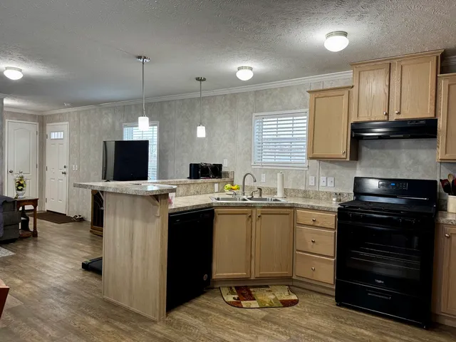 a kitchen with a sink and cabinets