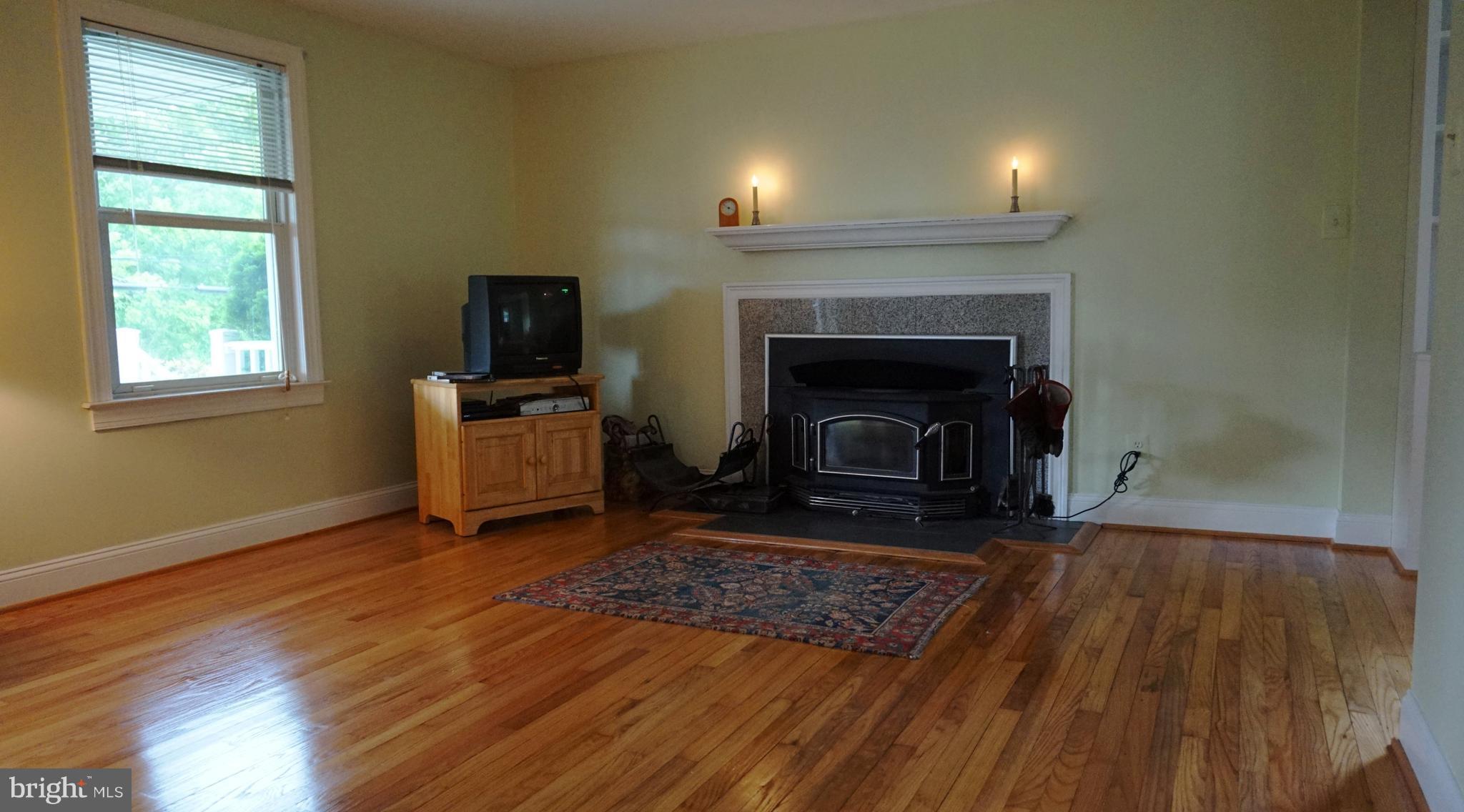 2103 Stringtown Road Sparks, MD 21152 - Photo 14 of 30 a living room with a fireplace