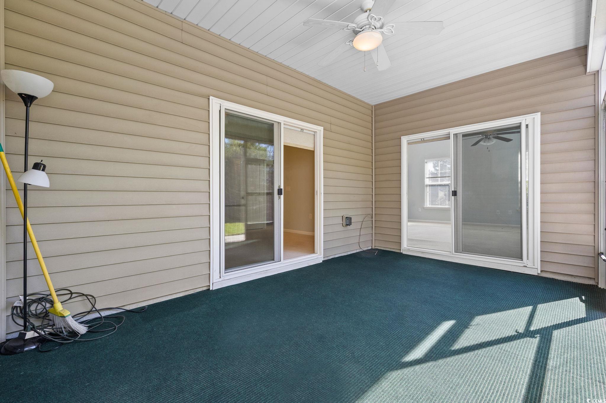 817 Arezzo Way, Unit 1001 Myrtle Beach, SC 29579 - Photo 34 of 40 Unfurnished sunroom with ceiling fan
