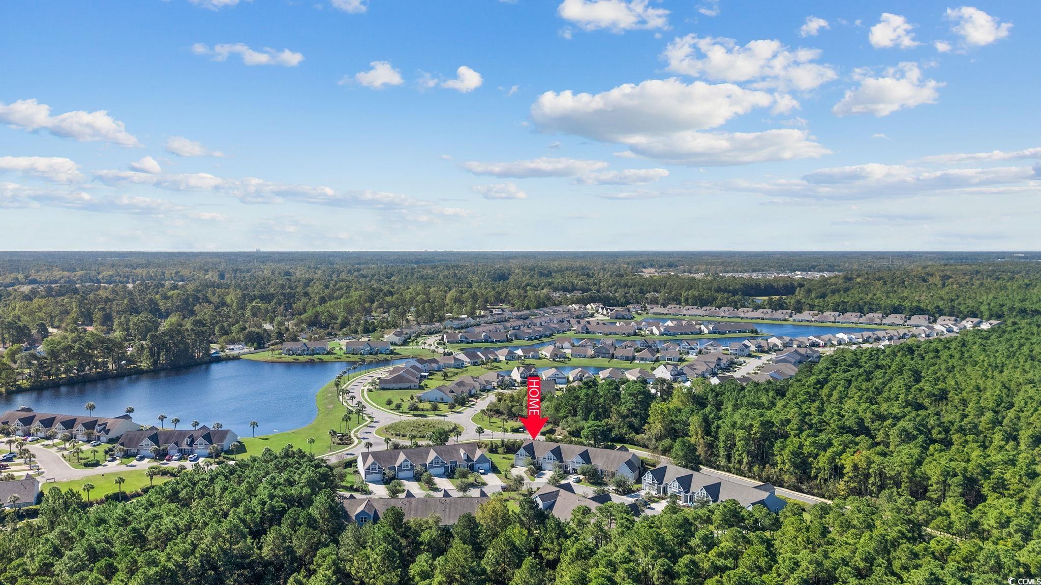 817 Arezzo Way, Unit 1001 Myrtle Beach, SC 29579 - Photo 38 of 40 Aerial view of property and surrounding area with a nearby body of water and nearby suburban area