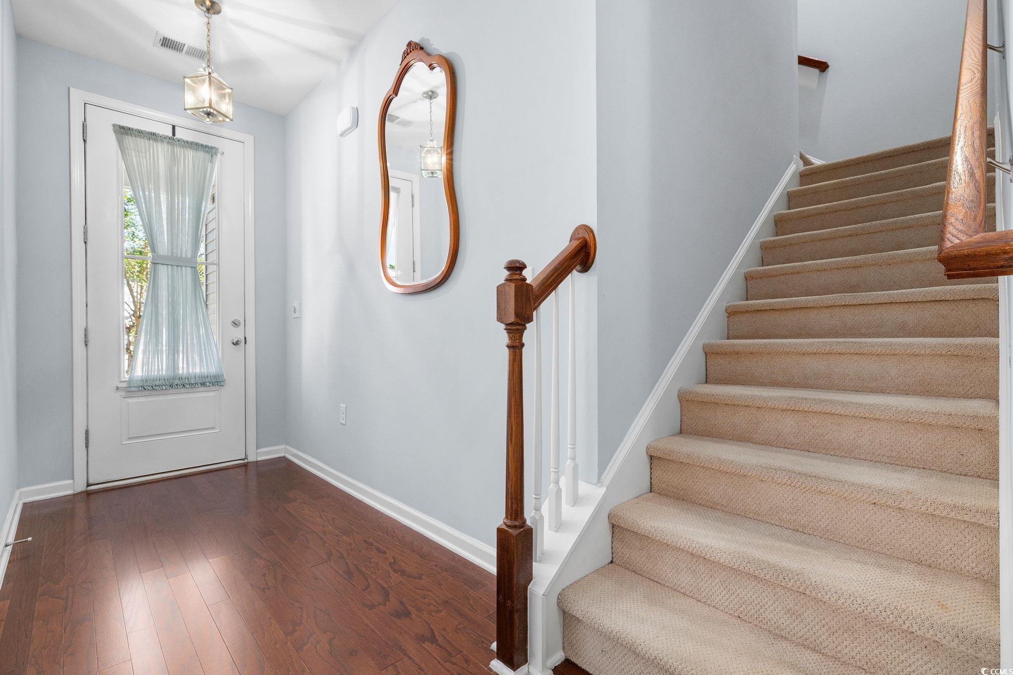817 Arezzo Way, Unit 1001 Myrtle Beach, SC 29579 - Photo 5 of 40 Entryway with dark wood-style floors and stairs