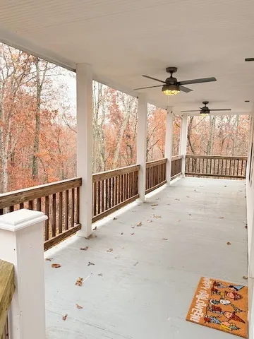 a view of a porch with wooden floor