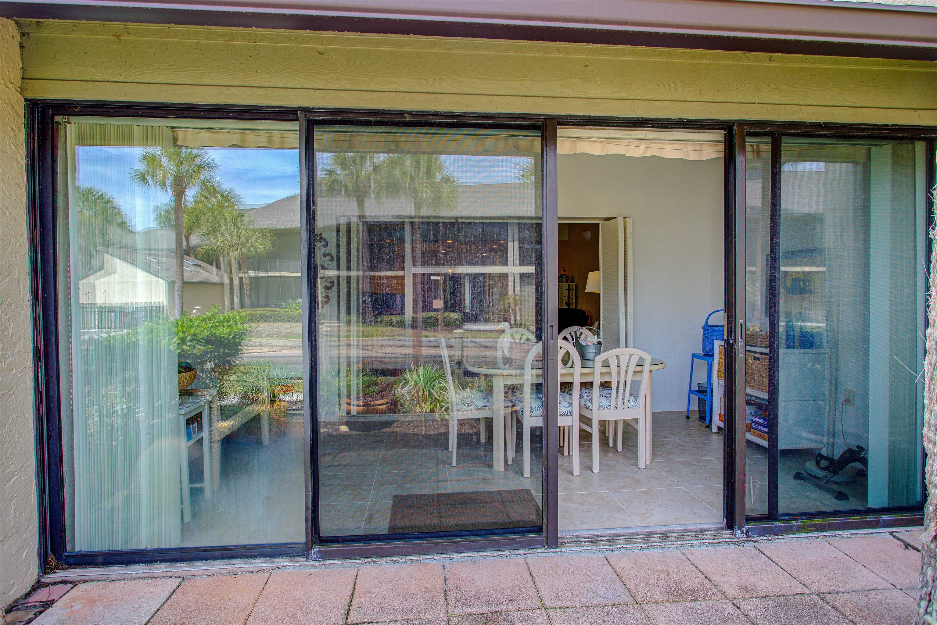 82 Village Las Palmas Circle St. Augustine, FL 32080 - Photo 12 of 58 View of exterior entry featuring a patio area