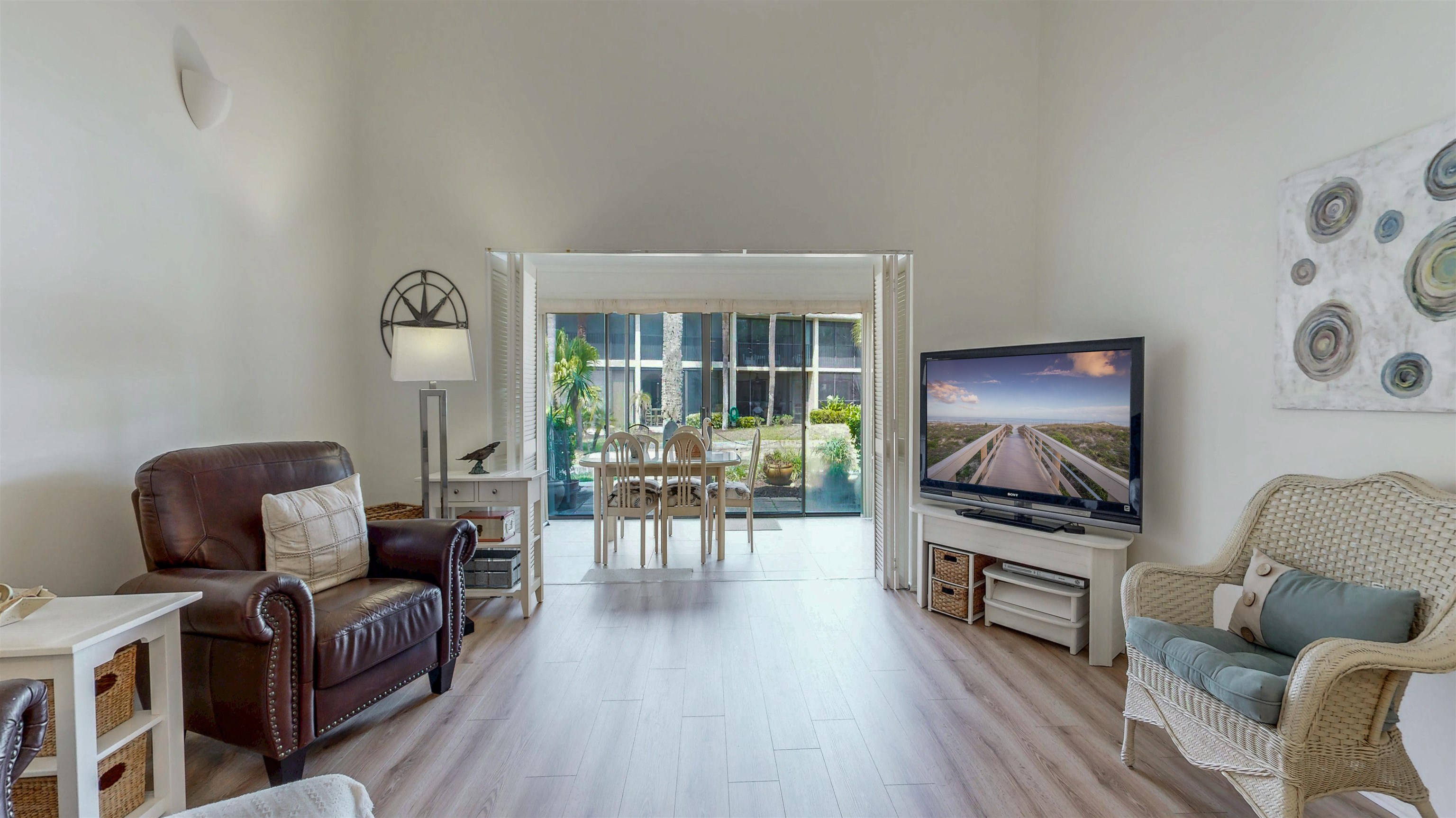 82 Village Las Palmas Circle St. Augustine, FL 32080 - Photo 21 of 58 Sitting room with light wood-style floors and a high ceiling
